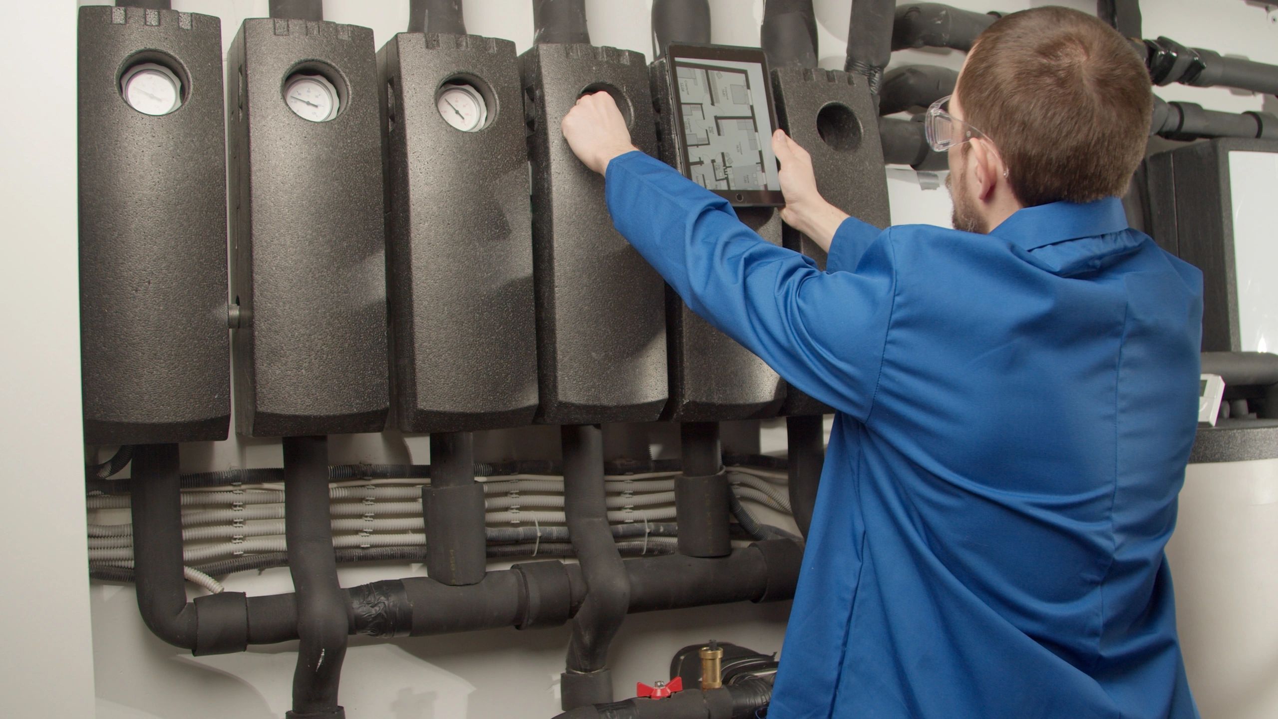 Technician checking HVAC gauges