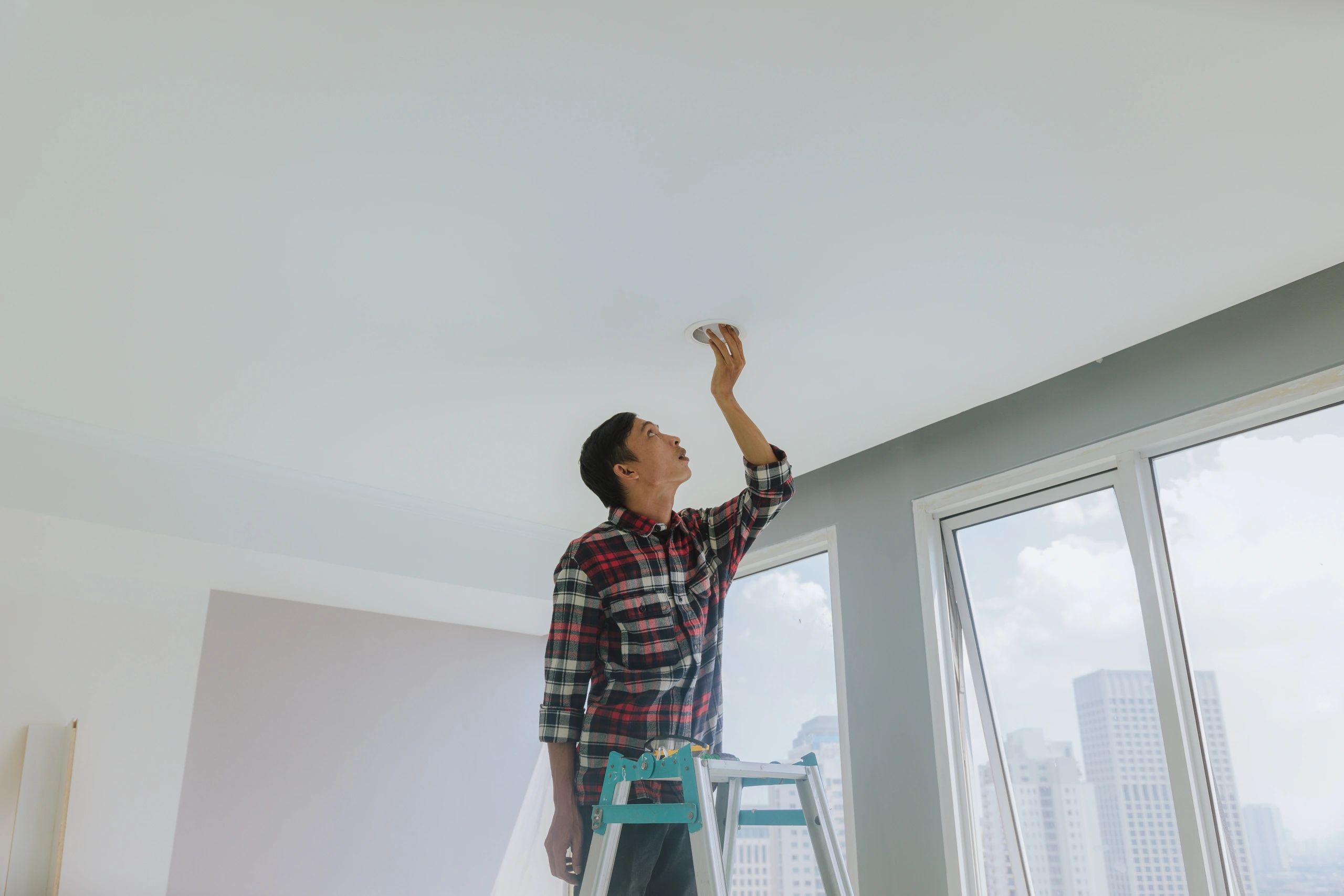 HVAC technician servicing a residential air conditioning and heat pump system